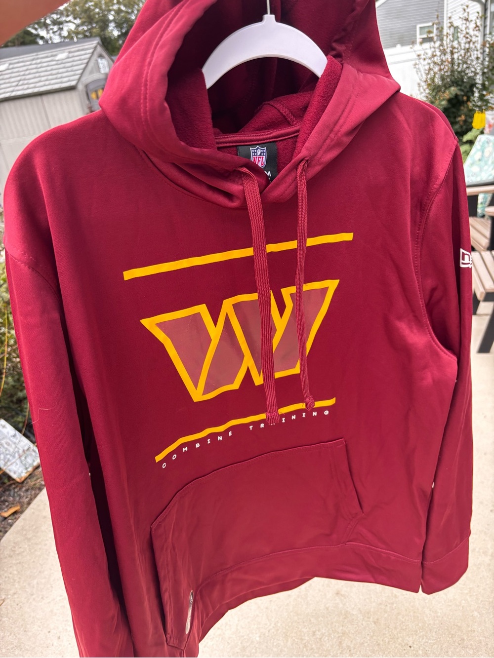 NFL Men's Washington Commanders authentic hoodie in burgundy color.